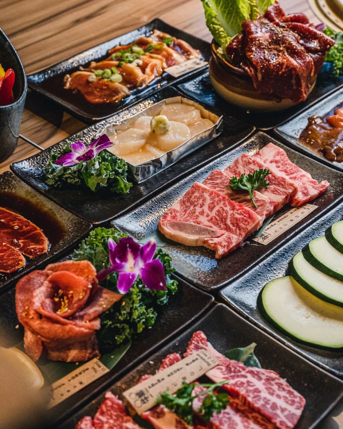 Platters of marbled wagyu and grilled seafood